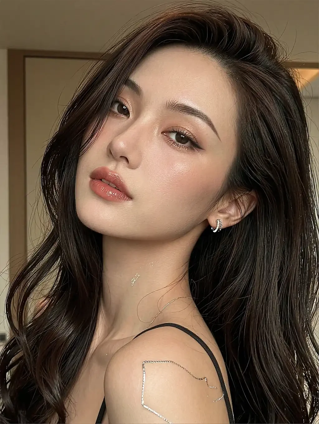 Fictional AI character with bare shoulders looking back past the camera, a framed picture on a warm wall